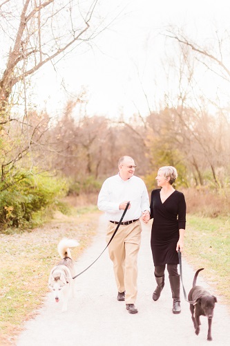 Photo of Jim Meyer and Lisa Meyer with their dogs